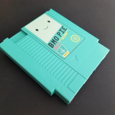 Nintendo NES case modified and spray painted in same color as the graphic label done in Illustrator to mimic retro game case labels. 
