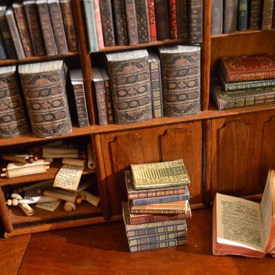 Bookcase with scrolls and books. Every book is individually made by hand.